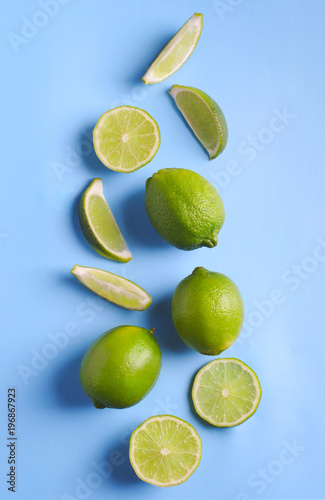 Fresh limes on light blue background