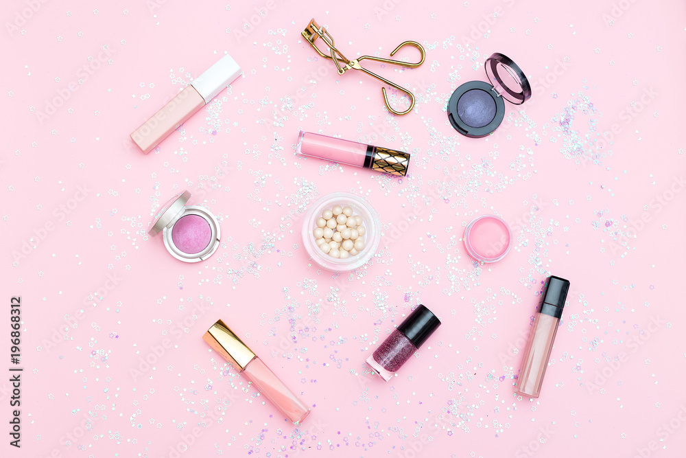 Cosmetics and accessories on a background of pink color. Flat lay Cosmetics and accessories on a background of pink color. Flat lay