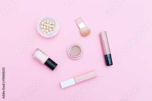 Nude cosmetics on pink background. Flat lay