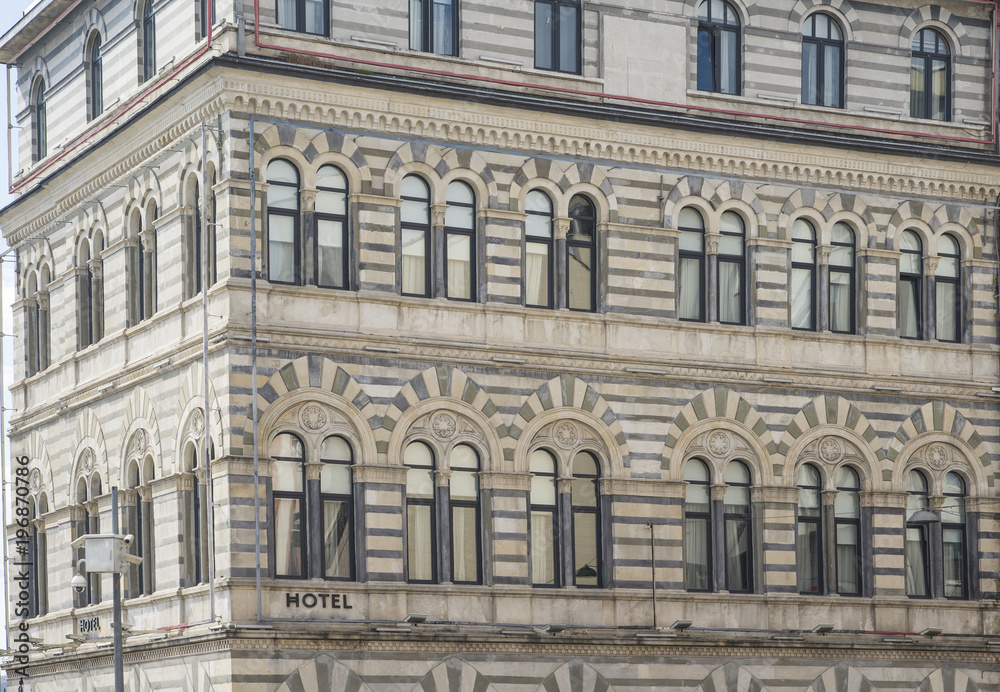 Hotel sign on the wall in the city