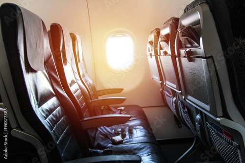 Seats of an airplane, with a window © studio4pic
