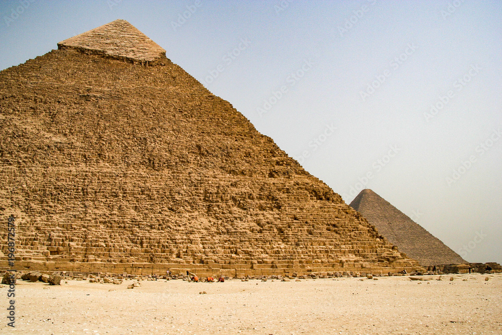 The Giza pyramid complex is an archaeological site on the Giza Plateau, on the outskirts of Cairo, Egypt.