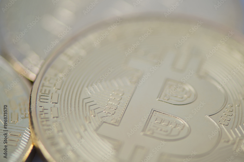 several gold bitcoin closeup, blurred photo. electronic money