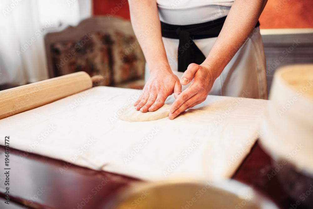 Male chef hands and dough, strudel cooking