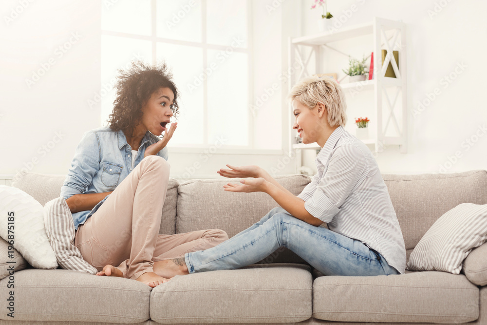Two young female friends conversing Two young female friends conversing