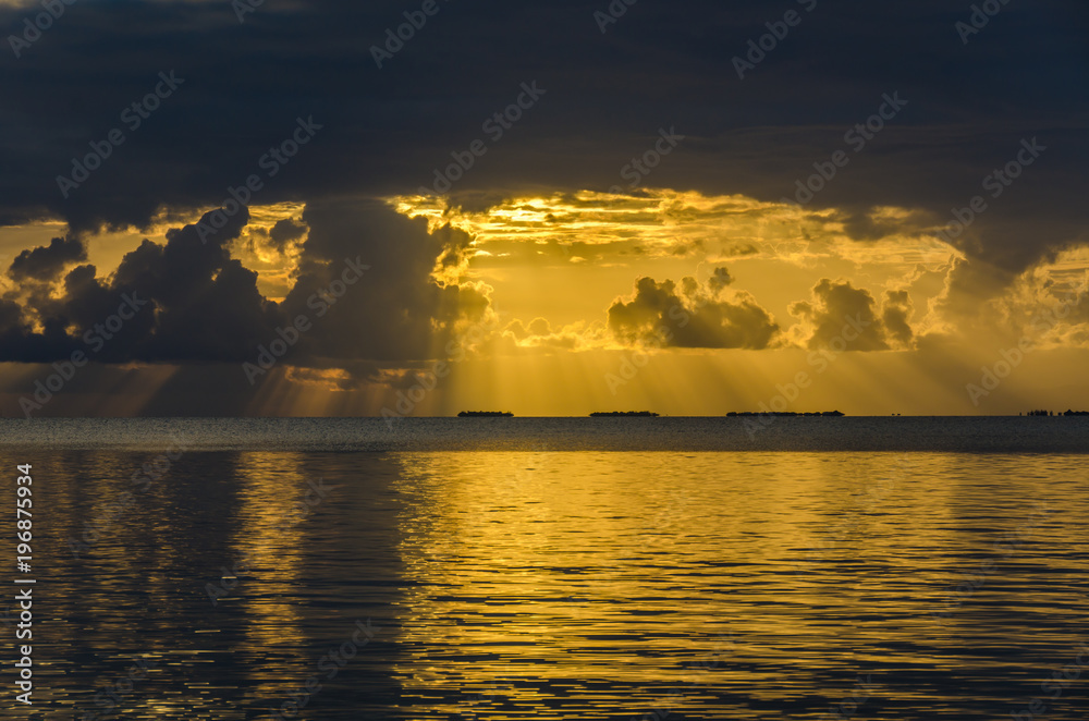 Sunset at South Water Caye - Small tropical island at Barrier Reef with paradise beach - known for diving, snorkeling and relaxing vacations - Caribbean Sea, Belize, Central America Sunset at South Water Caye - Small tropical island at Barrier Reef with paradise beach - known for diving, snorkeling and relaxing vacations - Caribbean Sea, Belize, Central America