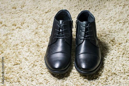 Black man's leather boots. Stylish black man's shoes.