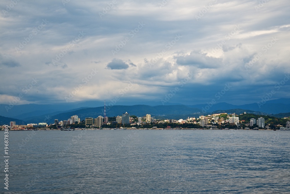 Seaside of the Sochi city. High buildings on the coast. Beauty sky clouds. 