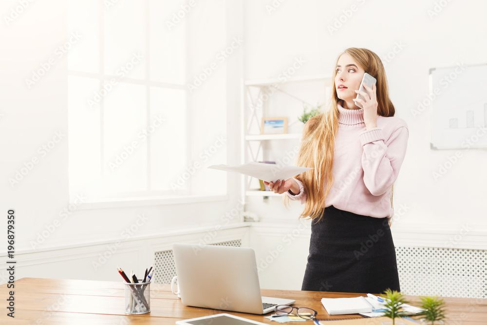 Business talk, woman consulting by phone at office Business talk, woman consulting by phone at office