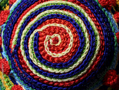 pinwheel with woven threads in the shape of a circle