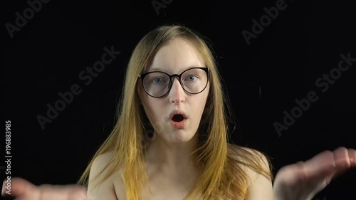 Shoked blond woman in glasses photo