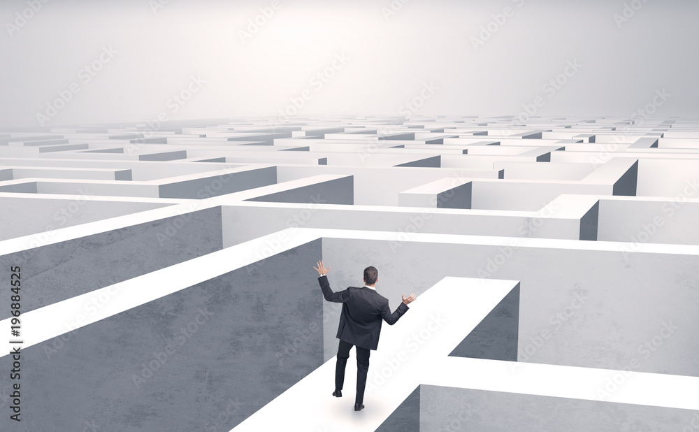 Small businessman in a middle of a maze