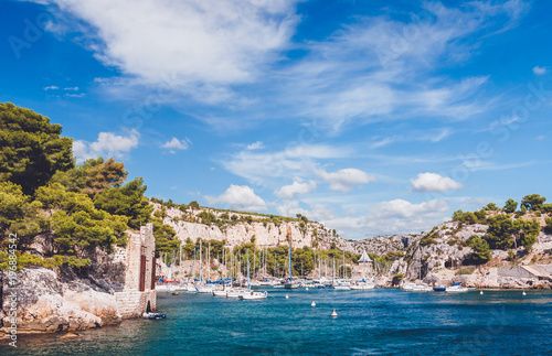 Harbour with yachts and boats in picturesque rocky inlet of Calanques in Cassis near Marseille, France
