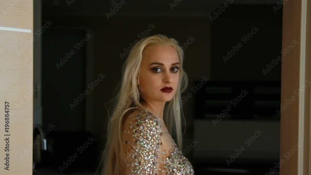 a woman stands with her back in the doorway turns sharply and turns away a woman stands with her back in the doorway turns sharply and turns away