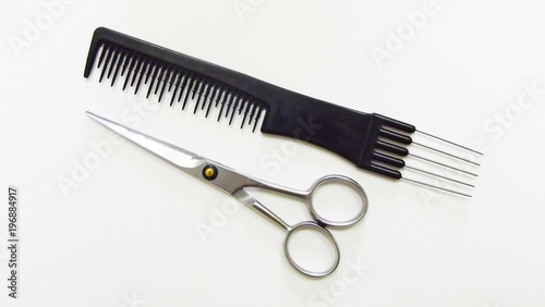 Hairdressing tools on white background.