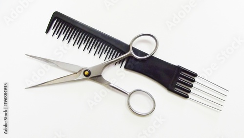 Hairdressing tools on white background.