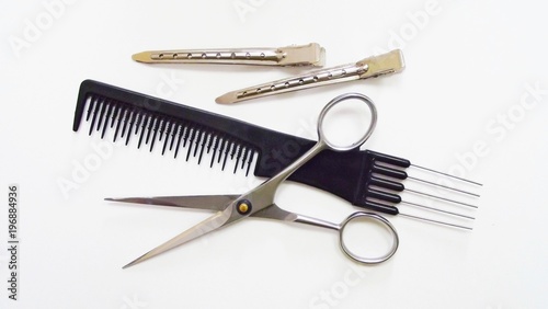 Hairdressing tools on white background.