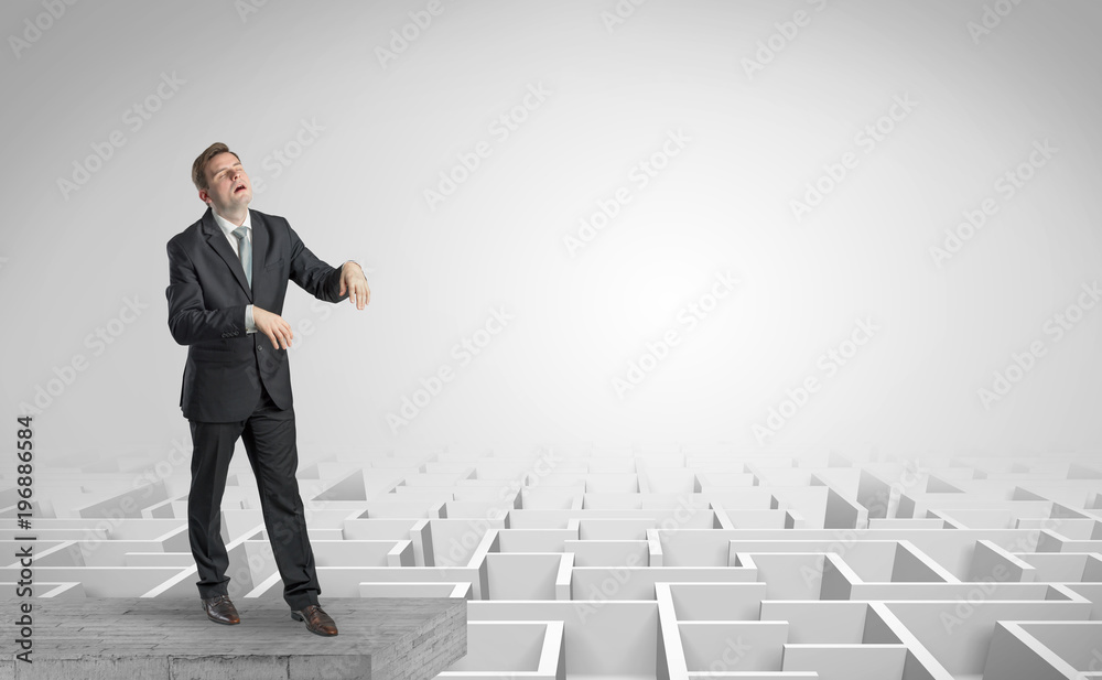 Sleepy businessman on the top of a labyrinth Sleepy businessman on the top of a labyrinth