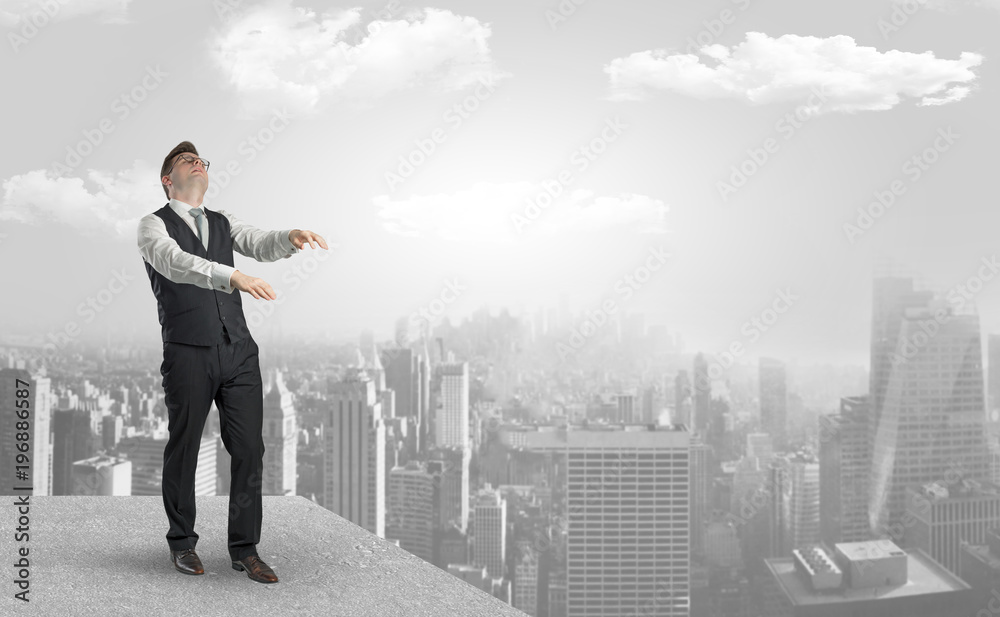 Sleepy businessman on the top of the city Sleepy businessman on the top of the city