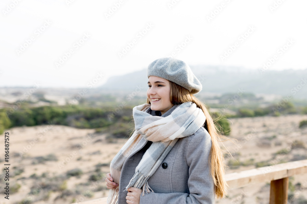 Pretty woman at wooden handrail