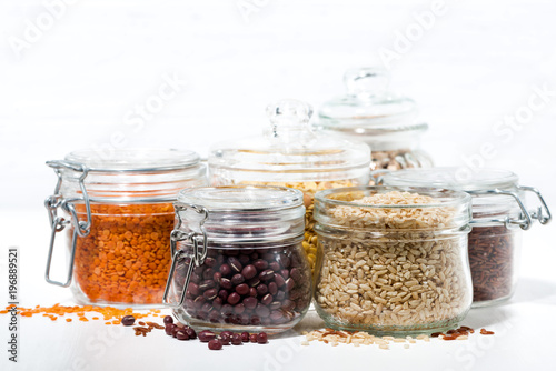 assortment of various cereals and legumes on white background