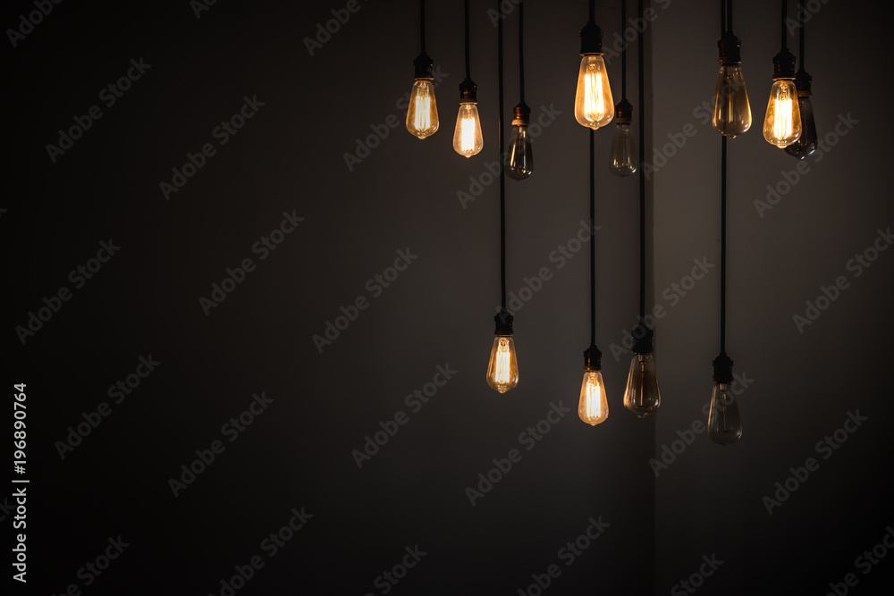 Idea concept with good and broken light bulbs hanging from ceiling - obrazy, fototapety, plakaty 