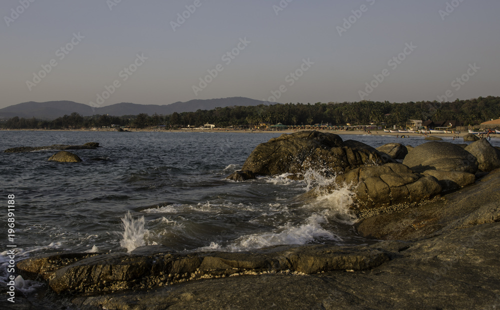 View of beach side with rocks.