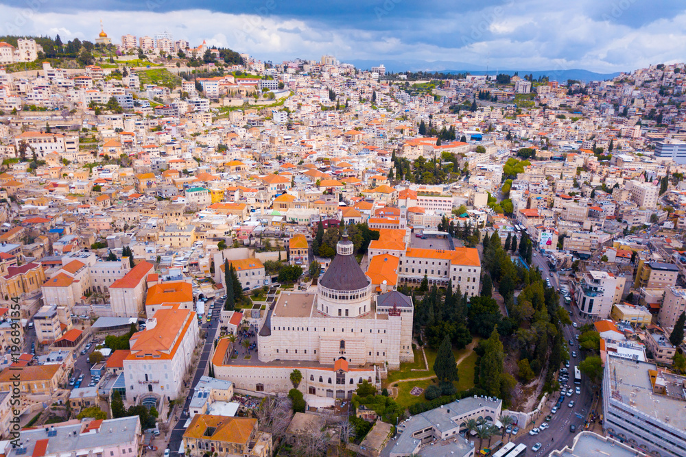 Fototapeta premium Aerial image of the Basilica of the Annunciation over the old city houses of Nazareth 