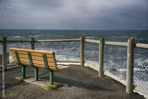 Park bench in Depoe Bay on the Oregon coast U.S.a. © westwindgraphics