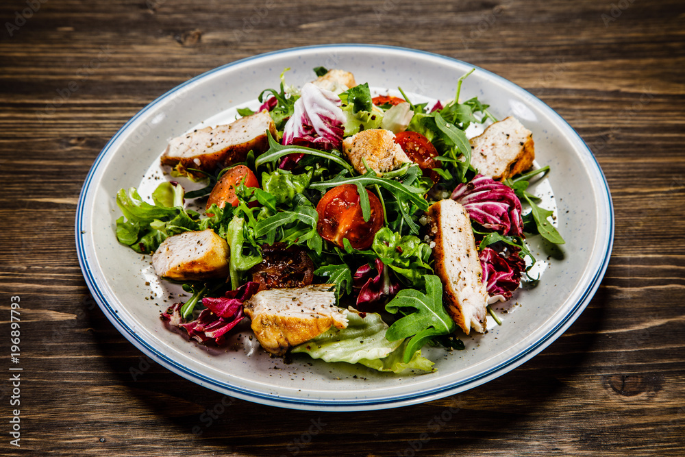 Caesar salad on wooden table Caesar salad on wooden table