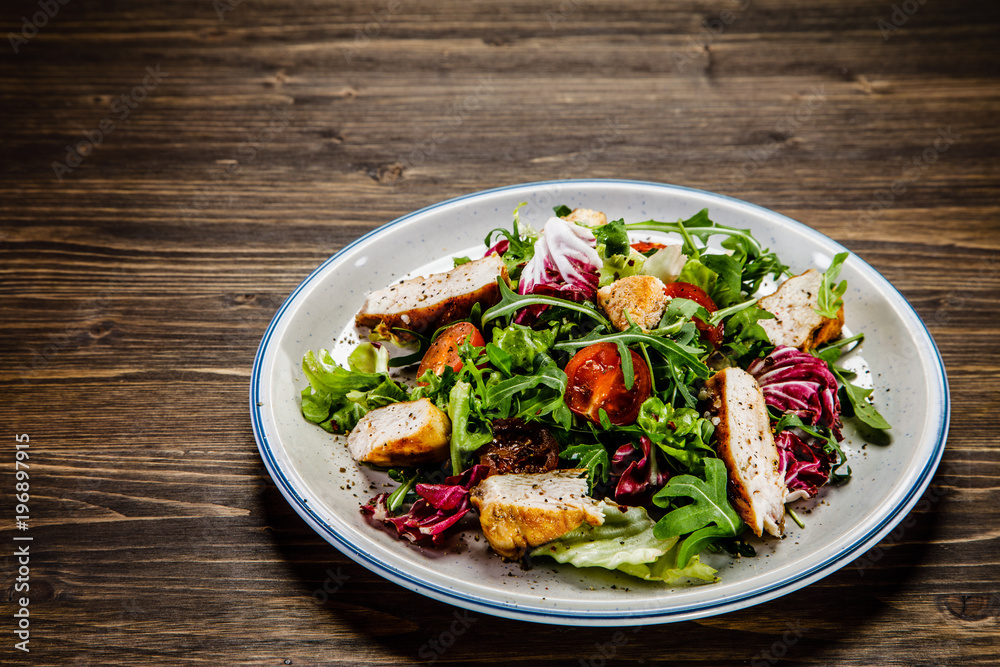 Caesar salad on wooden table 