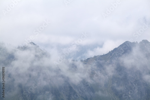 mountains in dense fog