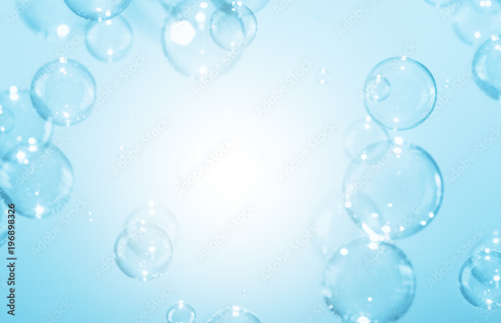 Abstract background bright soap bubbles floating in the air.