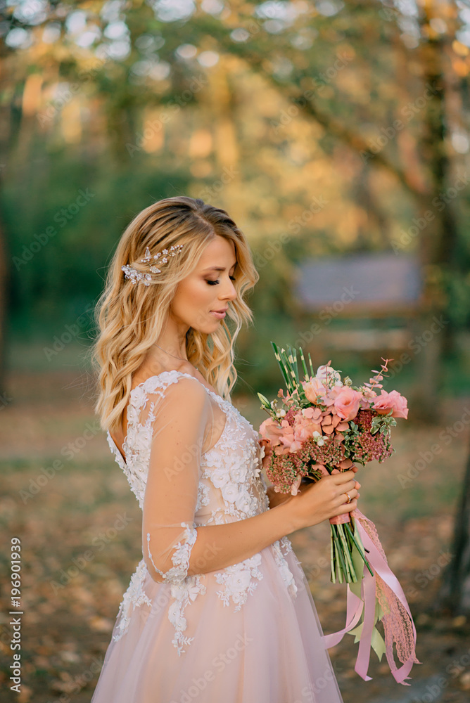 portrait of a young beautiful bride in the sun on a nature background portrait of a young beautiful bride in the sun on a nature background