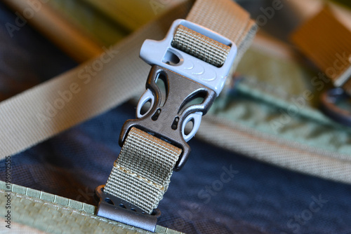 Canvas Print Closeup of nylon backpack with plastic straps, belts and clips