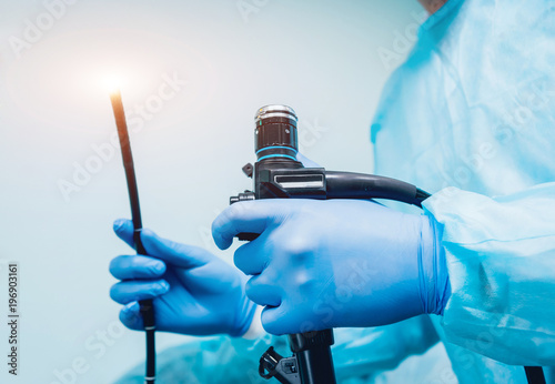 Endoscopy at the hospital. Doctor holding endoscope before gastroscopy photo