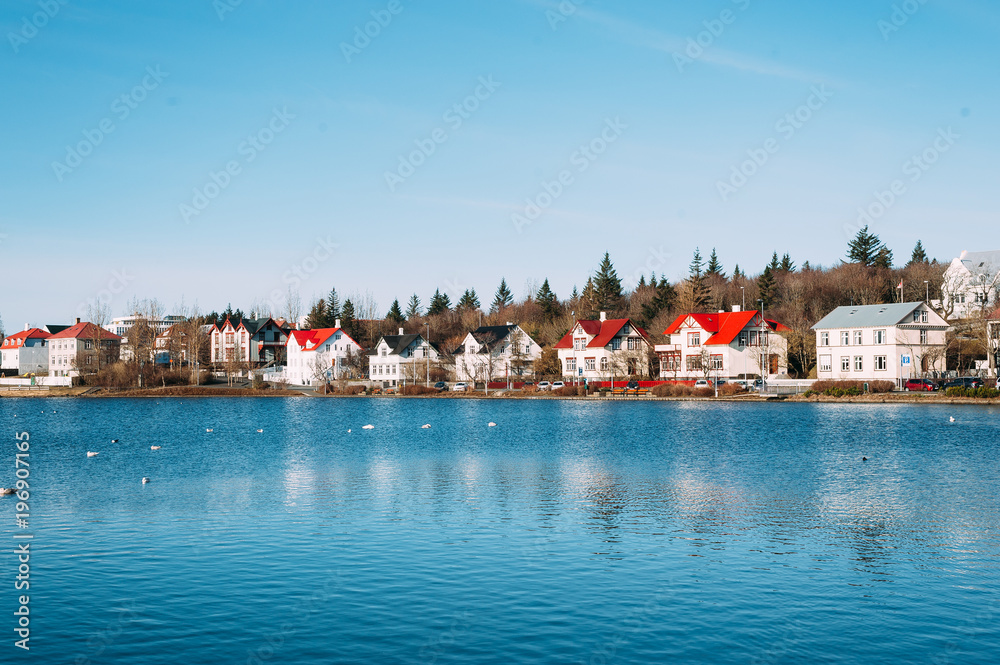 colorful houses on the shore of reykjavik lake