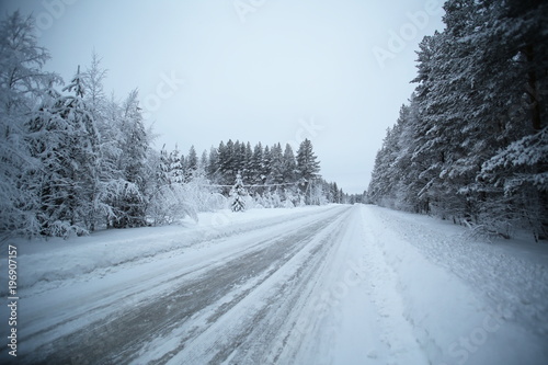 Icy road in Vaesterbotten in northern Sweden photo