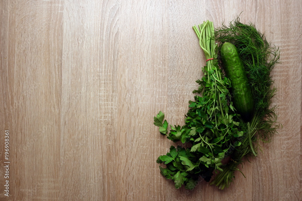 Green vegetables on wooden background with copy space for your text or object Green vegetables on wooden background with copy space for your text or object