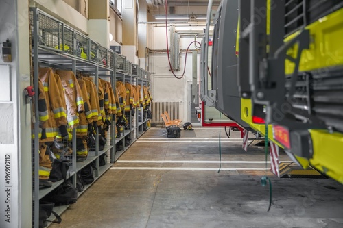 Firestation interior with vechicle and hanging cloth photo