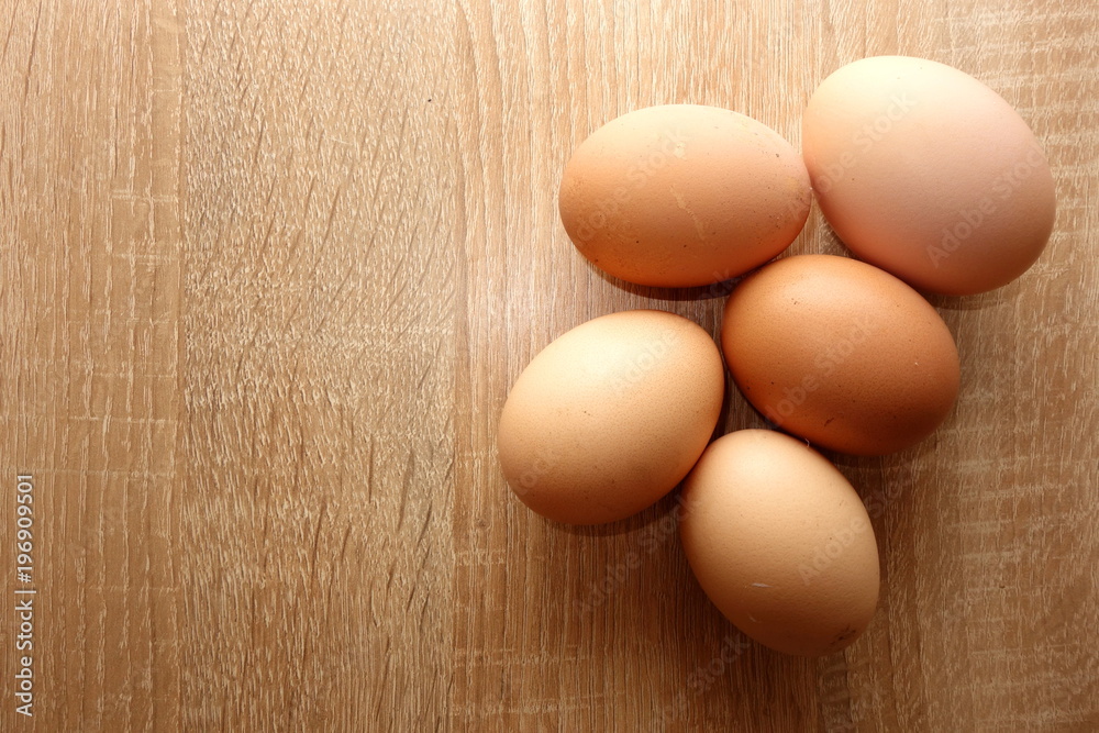 Eggs on rustic wooden background, view from overhead, copy space for your text or object Eggs on rustic wooden background, view from overhead, copy space for your text or object