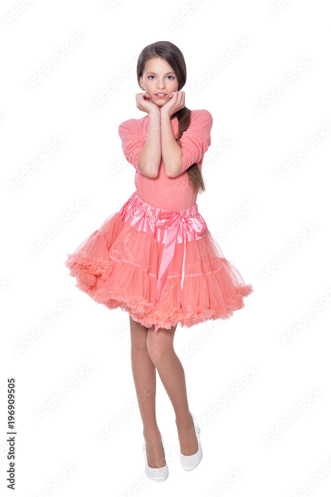 Happy little girl in pink dress posing isolated Happy little girl in pink dress posing isolated
