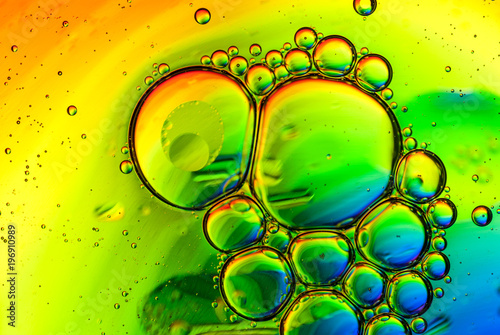 abstract multicolored background made of oil bubbles on water