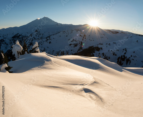 Beautiful panoramic American mountain landcape during a vibrant sunny sunset. Taken in Artist Point near Mount Baker, Northeast of Seattle, Washington, USA.