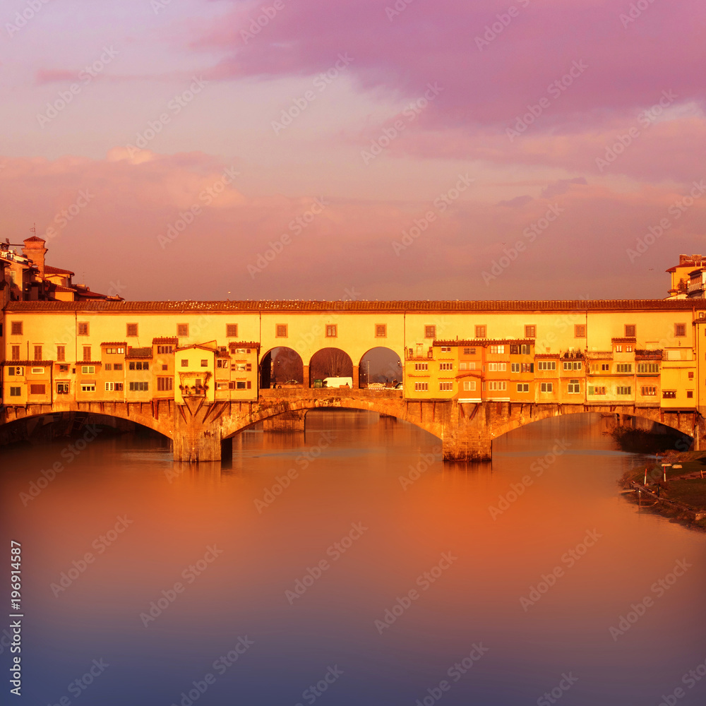Beautiful Sunset view of Ponte Vecchio over Arno River in Florence, Italy. 