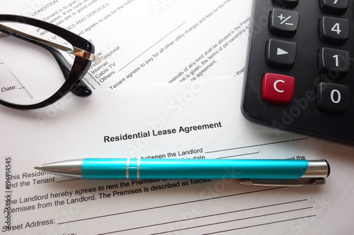 Residential lease agreement form on desk