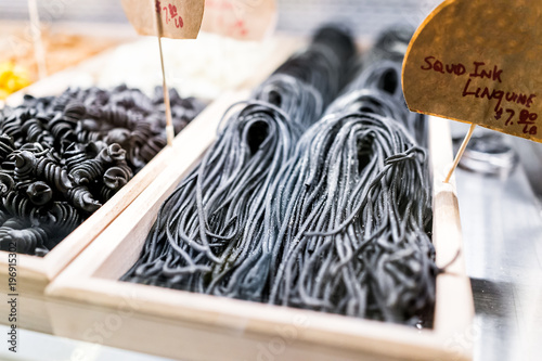 Vászonkép Closeup of black squid ink linguine pasta noodles fresh raw uncooked charcoal in