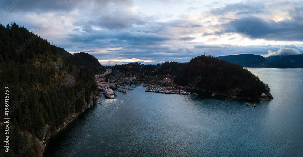 Aerial panoramic view of Horseshoe Bay in Howe Sound during a vibrant cloudy sunset. Taken West Vancouver, British Columbia, Canada.