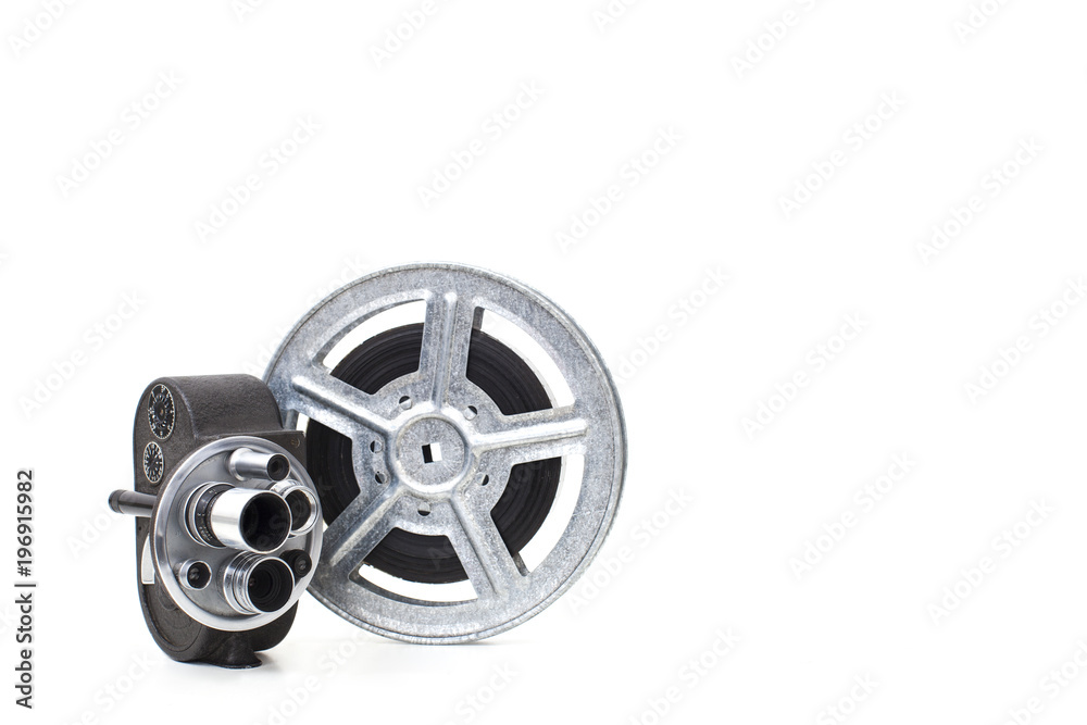 old 8 mm camera and film reel on white