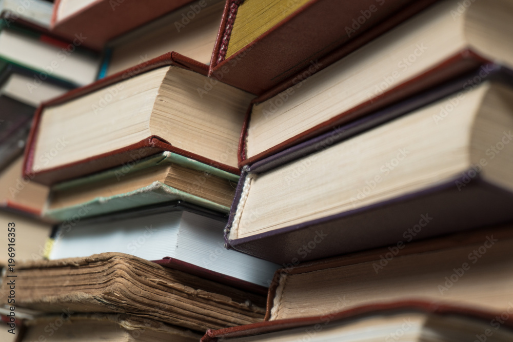Many books in a bookstore or library on wooden background with copy space Many books in a bookstore or library on wooden background with copy space